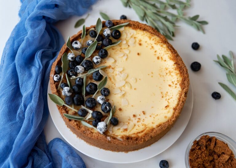 A top view of cheesecake with blueberries on top